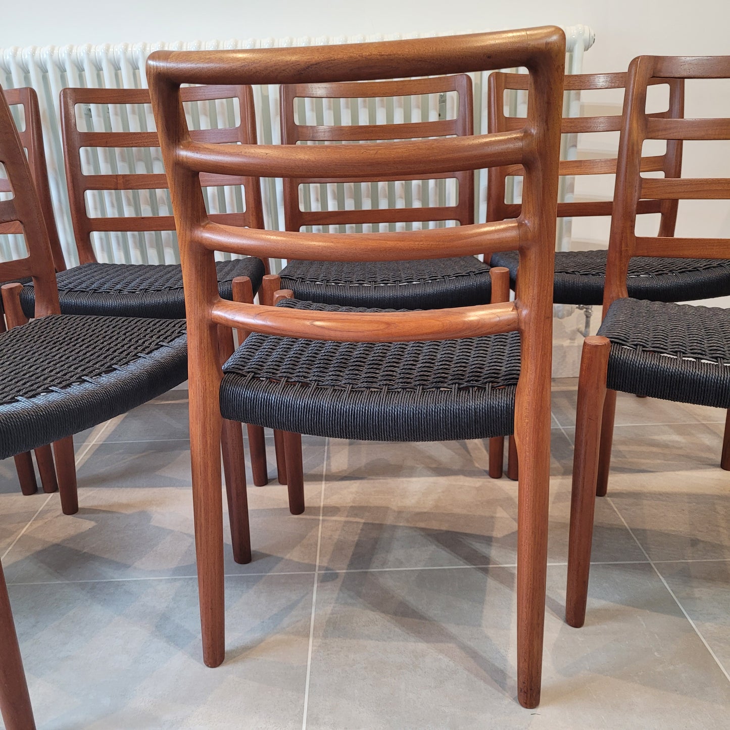 Set of 8 Niels Otto Møller #85 Teak chairs black paper cord seat