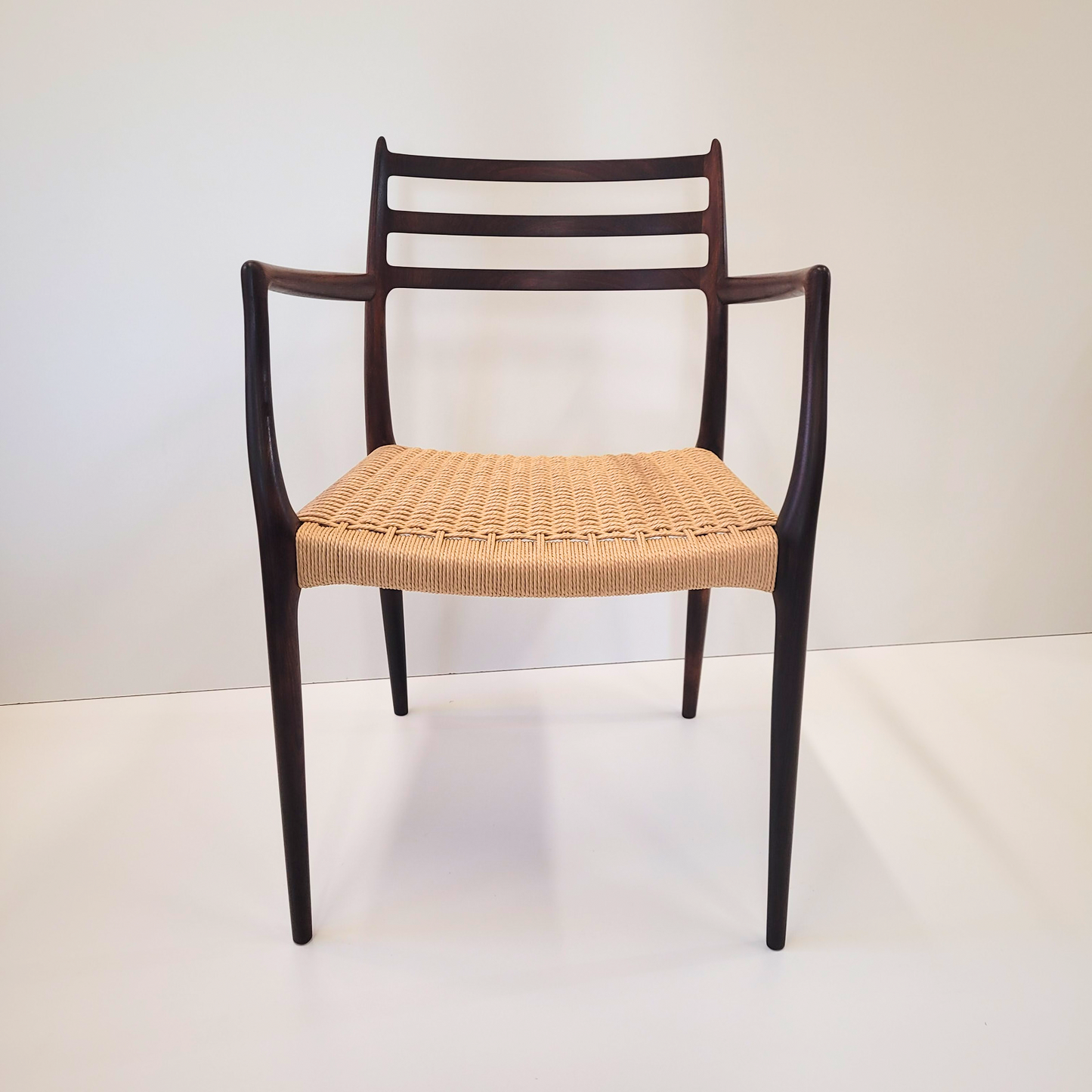 Niels Otto Møller #62 Rosewood carver dining chair