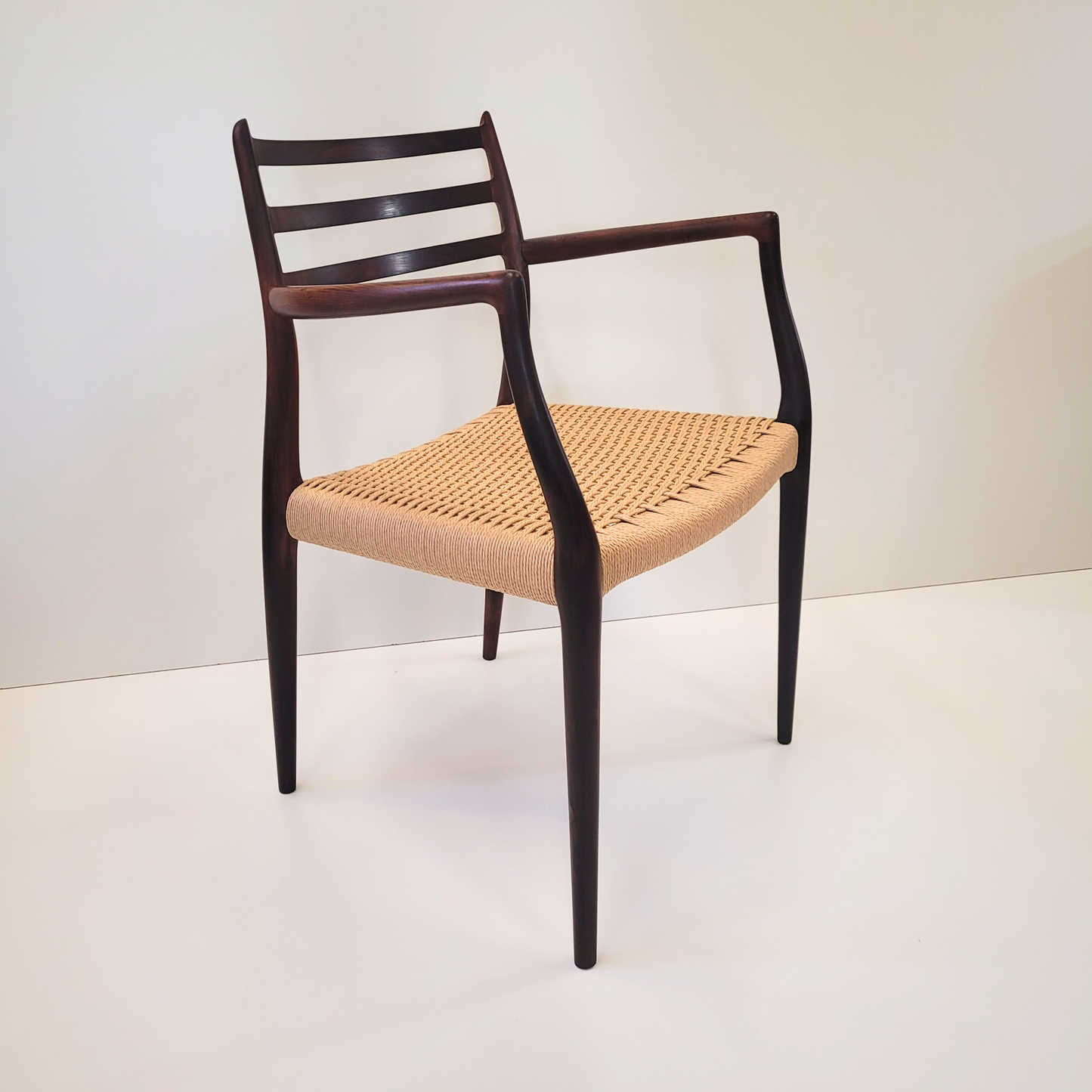 Niels Otto Møller #62 Rosewood carver dining chair