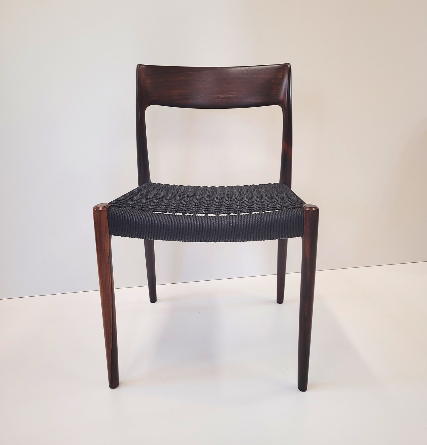 Niels Otto Møller #77 Rosewood dining chair black paper cord seat