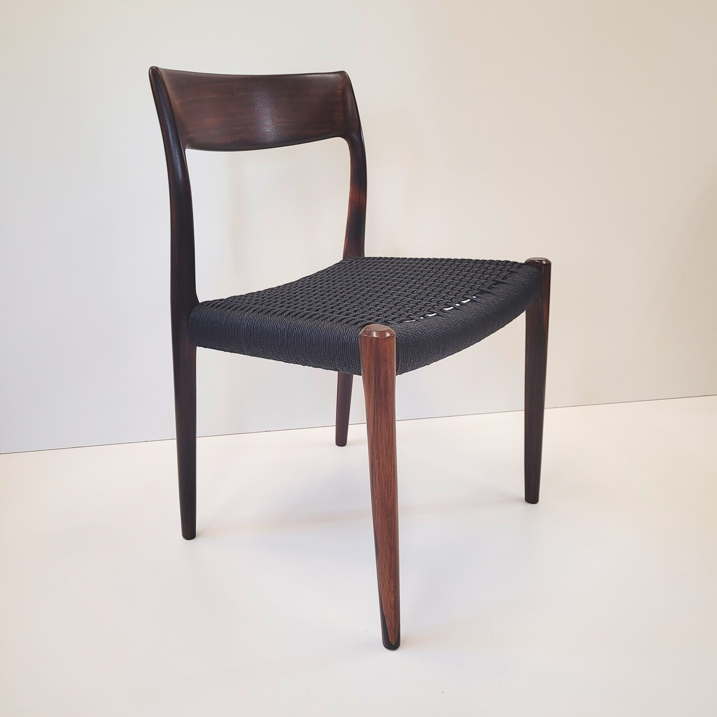 Niels Otto Møller #77 Rosewood dining chair black paper cord seat