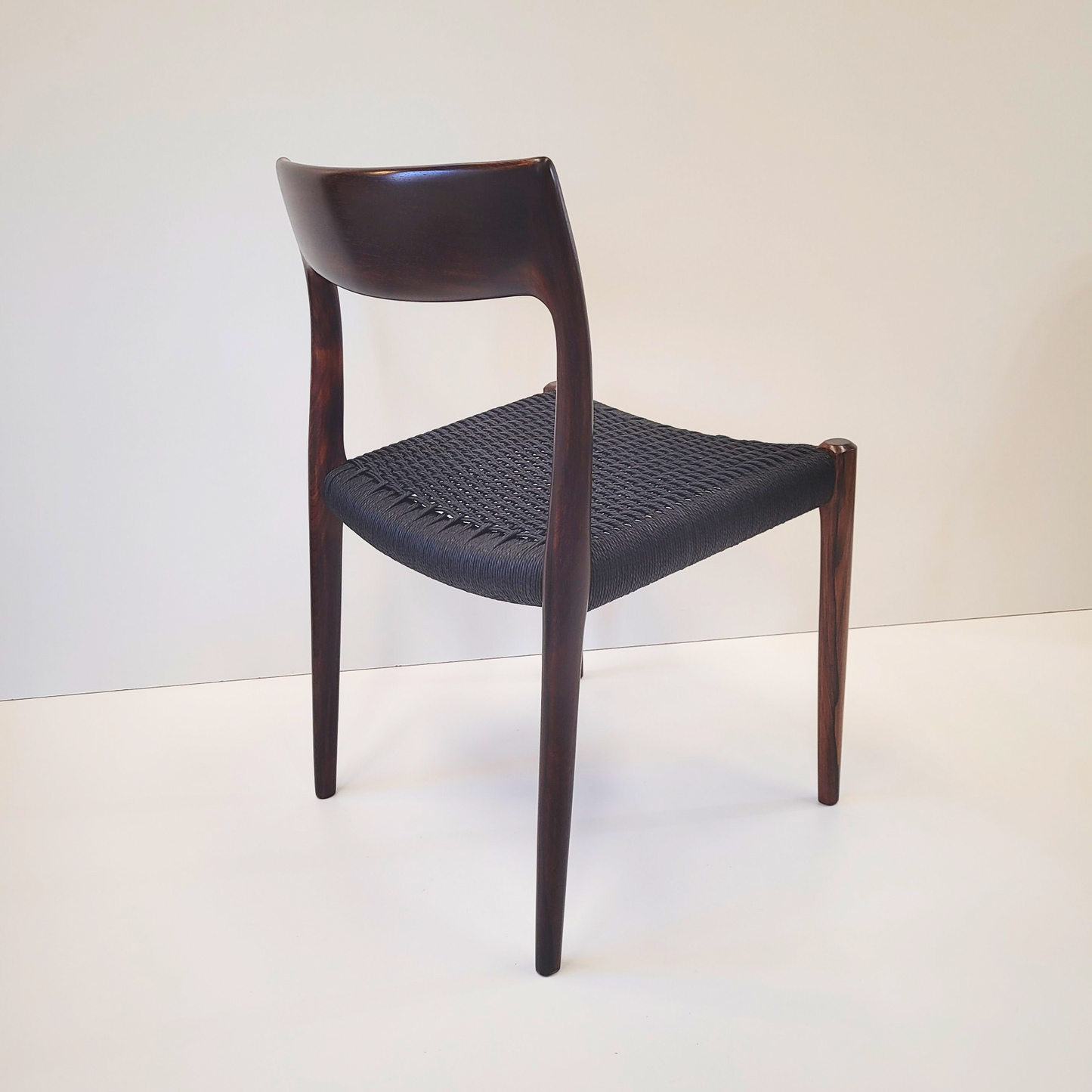 Niels Otto Møller #77 Rosewood dining chair black paper cord seat