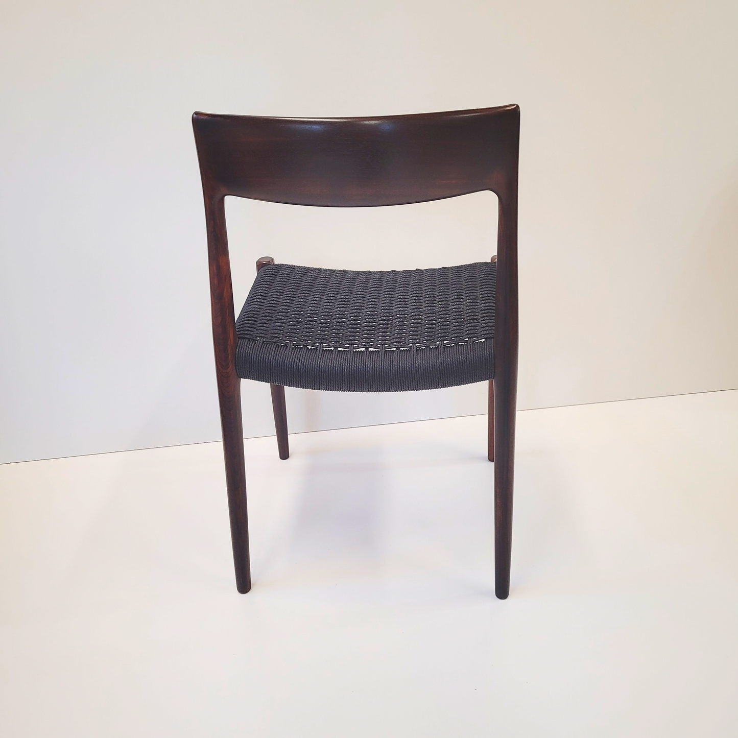 Niels Otto Møller #77 Rosewood dining chair black paper cord seat