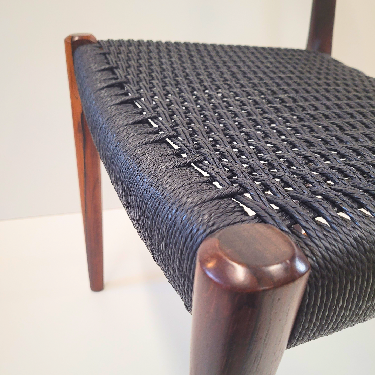 Niels Otto Møller #77 Rosewood dining chair black paper cord seat